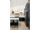 Well-equipped kitchen boasts an island, stainless steel appliances, and modern pendant lighting at 6438 E Montreal Pl, Scottsdale, AZ 85254