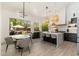Bright kitchen with center island, pendant lighting, stainless appliances, and a view to the outdoor space at 6438 E Montreal Pl, Scottsdale, AZ 85254