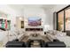 Contemporary living room with a long fireplace, comfortable sofas, and recessed lighting at 6438 E Montreal Pl, Scottsdale, AZ 85254