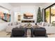 Spacious living room with a modern fireplace, TV, and comfortable seating at 6438 E Montreal Pl, Scottsdale, AZ 85254