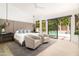 Spacious main bedroom with sliding doors to the backyard pool, offering seamless indoor-outdoor living experience at 6438 E Montreal Pl, Scottsdale, AZ 85254
