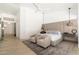 Comfortable main bedroom with seating area, ceiling fan, and access to an adjacent room at 6438 E Montreal Pl, Scottsdale, AZ 85254