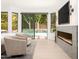 Bright main bedroom with a fireplace and sliding doors to a pool at 6438 E Montreal Pl, Scottsdale, AZ 85254
