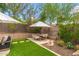 Cozy outdoor dining area with ample seating, perfect for entertaining guests in a serene backyard setting at 6438 E Montreal Pl, Scottsdale, AZ 85254
