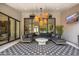 Cozy outdoor living space with a lounge area and large sliding glass doors at 6438 E Montreal Pl, Scottsdale, AZ 85254