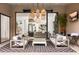 Inviting outdoor living area with comfortable seating, a TV, and a view of the pool at 6438 E Montreal Pl, Scottsdale, AZ 85254
