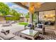 Covered patio featuring stylish pendant lights and an outdoor seating area at 6438 E Montreal Pl, Scottsdale, AZ 85254