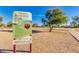 A welcoming sign to Kierland Park with park rules and address details against a backdrop of a lush park landscape at 6438 E Montreal Pl, Scottsdale, AZ 85254