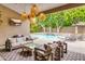 Inviting covered patio with comfortable seating and views of the pool at 6438 E Montreal Pl, Scottsdale, AZ 85254