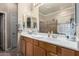 Bathroom featuring double sinks, vanity, and walk-in shower at 7150 W Avenida Del Rey --, Peoria, AZ 85383