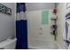 Bathroom with a white shower and bathtub combo, plus a blue and white shower curtain at 7150 W Avenida Del Rey --, Peoria, AZ 85383