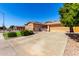 Well-maintained home featuring a three-car garage and tidy desert landscaping at 7150 W Avenida Del Rey --, Peoria, AZ 85383