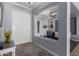 Inviting foyer with decorative archway and view into the bonus room at 7150 W Avenida Del Rey --, Peoria, AZ 85383