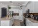Bright kitchen with white cabinetry, stainless steel appliances, and tiled backsplash at 7150 W Avenida Del Rey --, Peoria, AZ 85383
