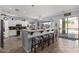 Open kitchen with a large island, breakfast bar seating, and backyard access at 7150 W Avenida Del Rey --, Peoria, AZ 85383