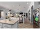 Bright kitchen overlooking living space, featuring large island, and modern appliances at 7150 W Avenida Del Rey --, Peoria, AZ 85383