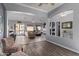 Open-concept living area with multiple sitting areas and stylish finishes at 7150 W Avenida Del Rey --, Peoria, AZ 85383