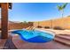 Beautiful pool with custom rock waterfall feature in a private backyard oasis at 7150 W Avenida Del Rey --, Peoria, AZ 85383