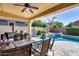 Enjoy this inviting backyard featuring a pool, hot tub, covered patio, and outdoor dining at 7363 E Plata Ave, Mesa, AZ 85212