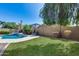 Enjoy the lush greenery of the backyard, complete with a pool and spa for ultimate relaxation and recreation at 7363 E Plata Ave, Mesa, AZ 85212