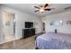 This cozy bedroom offers space, comfort, and style with neutral paint and natural light at 7363 E Plata Ave, Mesa, AZ 85212