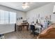 Inviting bedroom with bright decor, wood floors, and a well-lit ambiance for relaxation at 7363 E Plata Ave, Mesa, AZ 85212