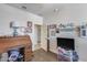 This bright bedroom boasts an antique roll-top desk, perfect for work or study at 7363 E Plata Ave, Mesa, AZ 85212