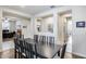 Large dining room with a stylish dark wood table and chairs, connecting seamlessly to the office at 7363 E Plata Ave, Mesa, AZ 85212