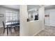 Open-concept hallway view leading to the dining area and office space, creating a welcoming atmosphere at 7363 E Plata Ave, Mesa, AZ 85212