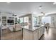 Open floor plan from kitchen to living room and dining area at 7363 E Plata Ave, Mesa, AZ 85212