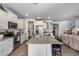 Open concept kitchen with stainless steel appliances and breakfast bar seating at 7363 E Plata Ave, Mesa, AZ 85212