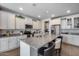 Spacious kitchen with granite countertops, white cabinets, and stainless steel appliances at 7363 E Plata Ave, Mesa, AZ 85212