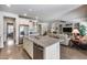 Open kitchen with granite counters, stainless appliances, and view to living room at 7363 E Plata Ave, Mesa, AZ 85212