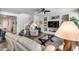 Spacious living room with staircase, built-in shelves, and comfortable leather seating at 7363 E Plata Ave, Mesa, AZ 85212