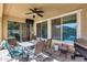 Relaxing outdoor patio features tile flooring, ceiling fan, and a dining table at 7363 E Plata Ave, Mesa, AZ 85212