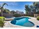 An inviting backyard pool and spa, nestled within a landscaped yard that's perfect for relaxation at 7363 E Plata Ave, Mesa, AZ 85212