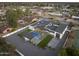 Aerial view of stylish home with pool, modern features, tennis court, and desert landscaping providing optimal outdoor living at 8040 E Carol Way, Scottsdale, AZ 85260