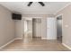 Spacious bedroom with a ceiling fan, closet, and wood flooring at 835 N Granite Reef Rd # 29, Scottsdale, AZ 85257