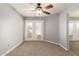 Neutral bedroom with access to a private balcony through sliding glass doors at 835 N Granite Reef Rd # 29, Scottsdale, AZ 85257