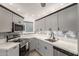 Bright kitchen featuring sleek stainless steel appliances and elegant quartz countertops at 835 N Granite Reef Rd # 29, Scottsdale, AZ 85257