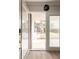 Exterior view of a patio through open glass doors, leading to a community pool area at 835 N Granite Reef Rd # 29, Scottsdale, AZ 85257