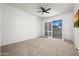 Bedroom with carpet, ceiling fan and natural light from the outdoor patio at 8989 N Gainey Center Dr # 149, Scottsdale, AZ 85258