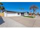 Charming renovated home featuring a spacious driveway, two-car garage, and well-manicured desert landscaping at 9028 N 48Th Dr, Glendale, AZ 85302