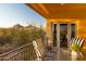 Inviting balcony with outdoor seating, offering views of the surrounding landscape at 9716 E Mariposa Grande Dr, Scottsdale, AZ 85255
