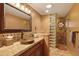 Bathroom with custom tile work, stylish sink, and a block glass shower at 9716 E Mariposa Grande Dr, Scottsdale, AZ 85255