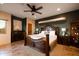 Bedroom with elegant wood furniture, a fireplace, and neutral tones at 9716 E Mariposa Grande Dr, Scottsdale, AZ 85255