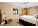 Bedroom with wood accents, a large window providing natural light, and neutral decor at 9716 E Mariposa Grande Dr, Scottsdale, AZ 85255