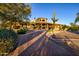 Beautiful home exterior with a desert landscape, unique architectural details, and a serene setting at 9716 E Mariposa Grande Dr, Scottsdale, AZ 85255