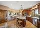 Spacious kitchen featuring a large island, breakfast bar, ample cabinetry, and modern appliances perfect for cooking at 9716 E Mariposa Grande Dr, Scottsdale, AZ 85255