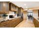 Well-equipped kitchen with custom wood cabinets, granite countertops, and stainless steel appliances at 9716 E Mariposa Grande Dr, Scottsdale, AZ 85255